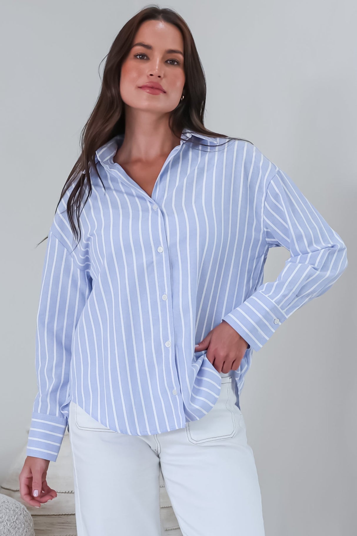 Model wearing a striped blue polo from Salty Crush