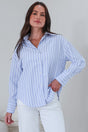 Model wearing a striped blue polo from Salty Crush