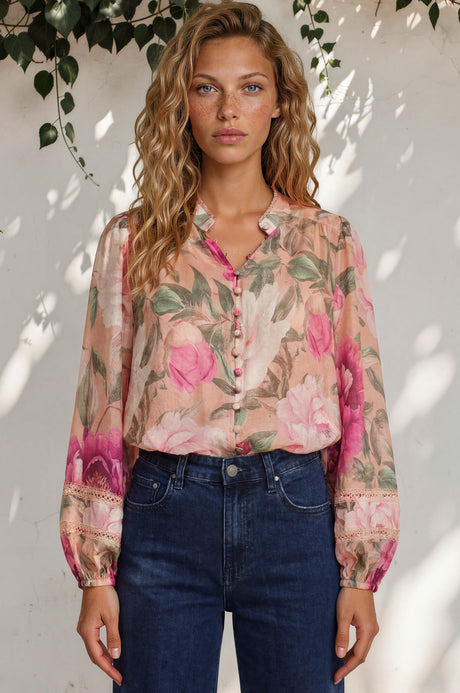 Woman wearing a floral blouse with a white background