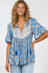 Model wearing Dove Top in Wyonna Print Blue from Salty Crush