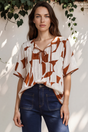 Model wearing Druitt Top in Oasis Print from Salty Crush