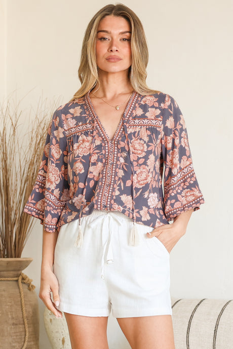 Model wearing Elysia Blouse in Leandra Print from Salty Crush
