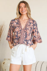 Model wearing Elysia Blouse in Leandra Print from Salty Crush