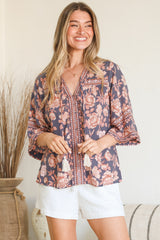 Model wearing Elysia Blouse in Leandra Print from Salty Crush