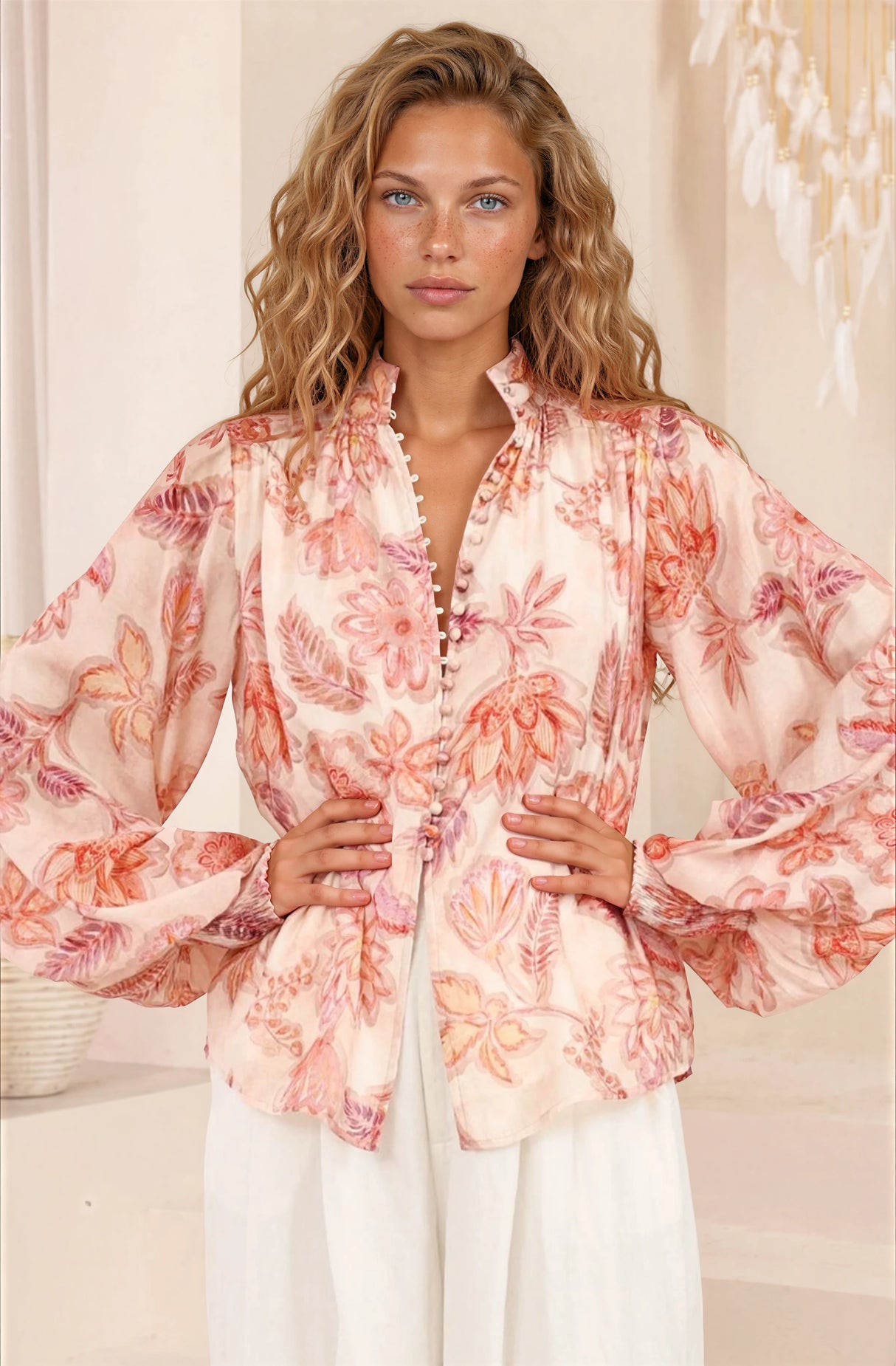 Model wearing Faye Blouse in Rory Print Pink from Salty Crush