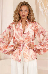 Model wearing Faye Blouse in Rory Print Pink from Salty Crush