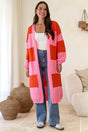 Model wearing Finneas Cardigan in Pink from Salty Crush