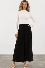 Model wearing Garcia Pants in Black from Salty Crush