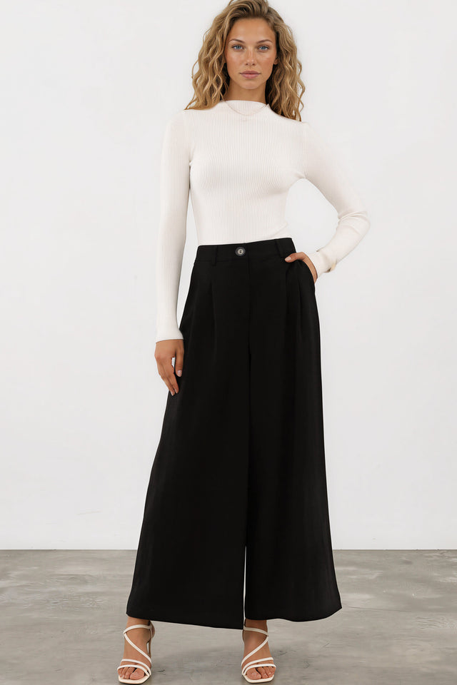 Model wearing Garcia Pants in Black from Salty Crush