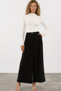 Model wearing Garcia Pants in Black from Salty Crush