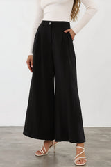 Model wearing Garcia Pants in Black from Salty Crush