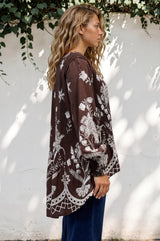 Model wearing Gelina Top in Gerry Print Chocolate from Salty Crush