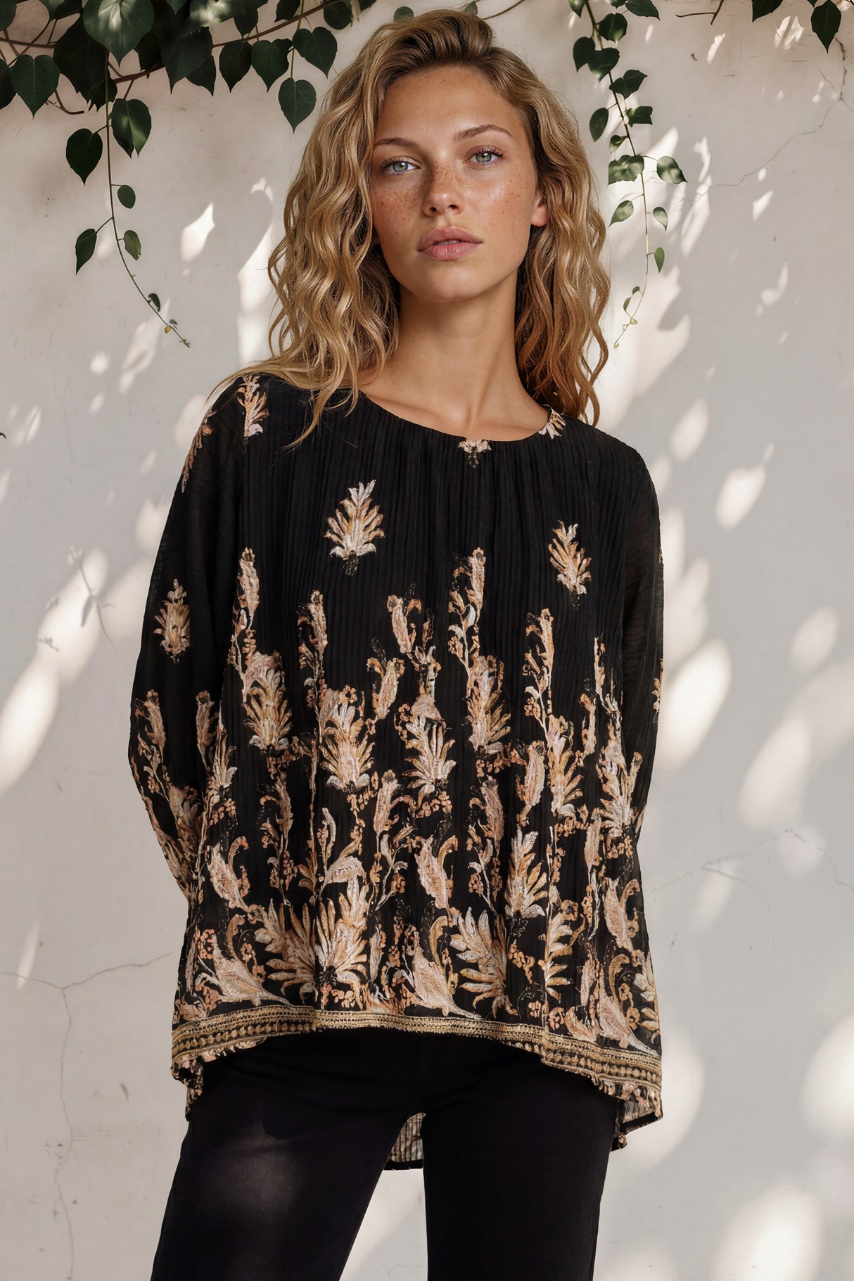Model wearing Gelina Top in Lynsey Print Black from Salty Crush
