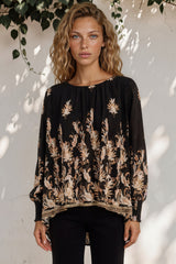 Model wearing Gelina Top in Lynsey Print Black from Salty Crush