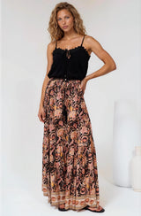 Model wearing Hellen Maxi Skirt in Pree Print Black from Salty Crush