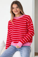 Model wearing Hershey Jumper in Pink/Red from Salty Crush