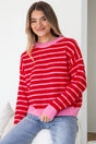Model wearing Hershey Jumper in Pink/Red from Salty Crush
