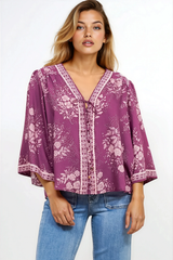 Model wearing Hollie Blouse in Briella Print Berry from Salty Crush