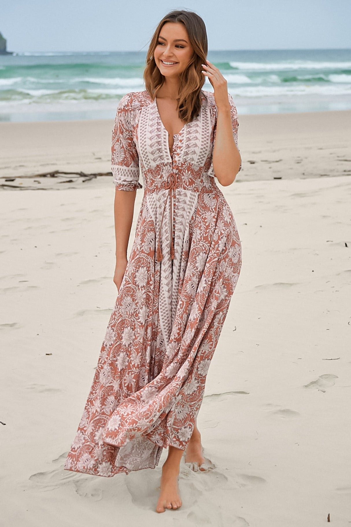 JAASE - Indiana Maxi Dress: Lace Back Shirred Waist A Line Dress with Handkerchief Hemline in Indah Print