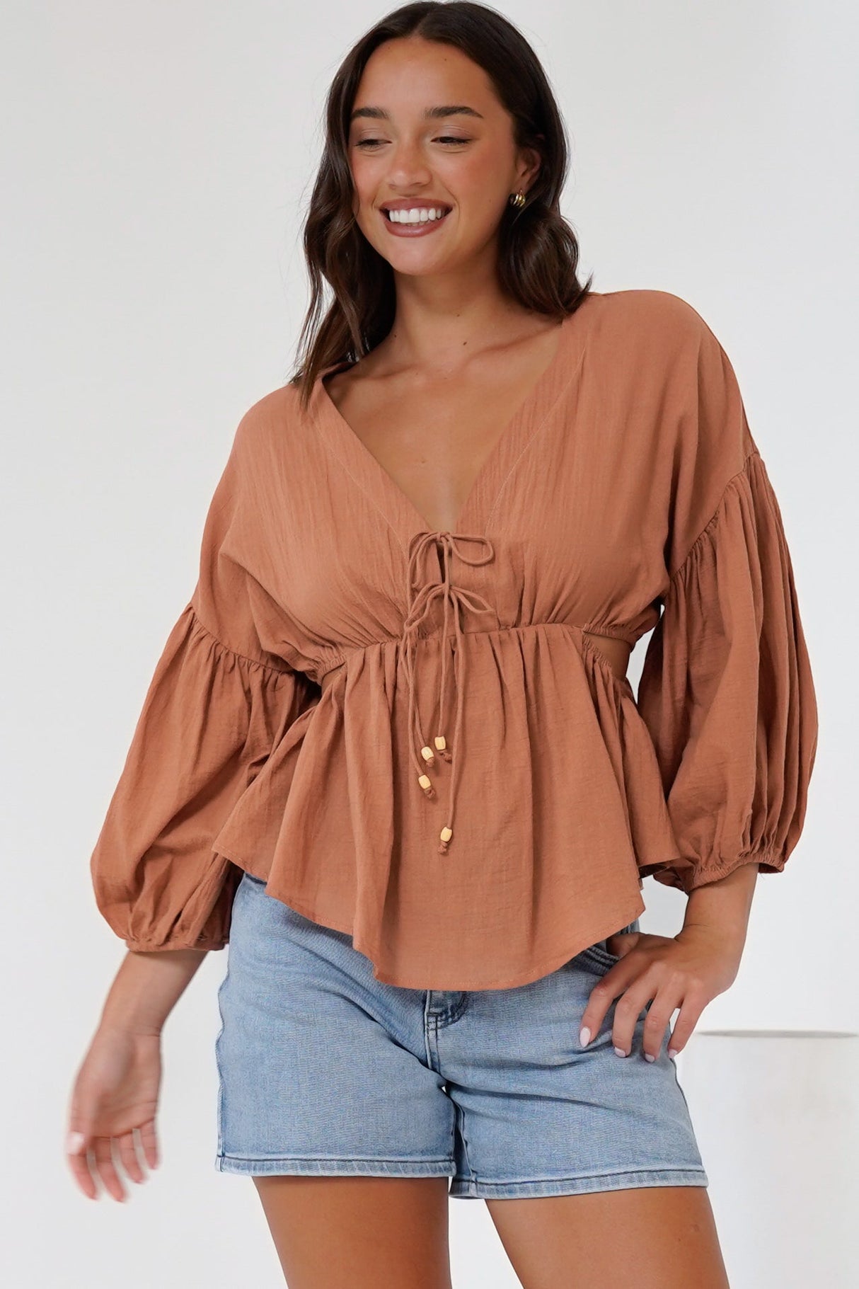 Jacobson Top - Peplum Top with Side Cut Outs and Voluminous Sleeves in Tan