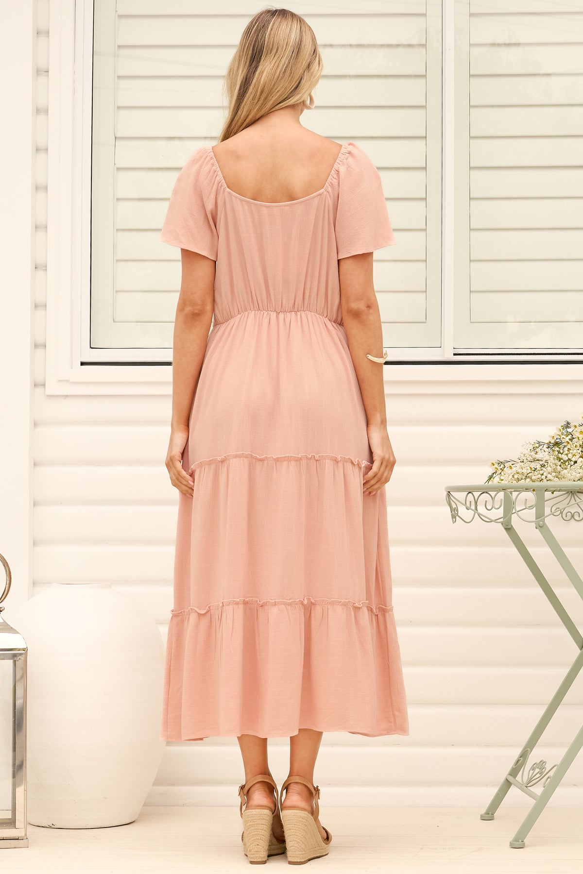 Model wearing Karina Midi Dress in Pink from Salty Crush