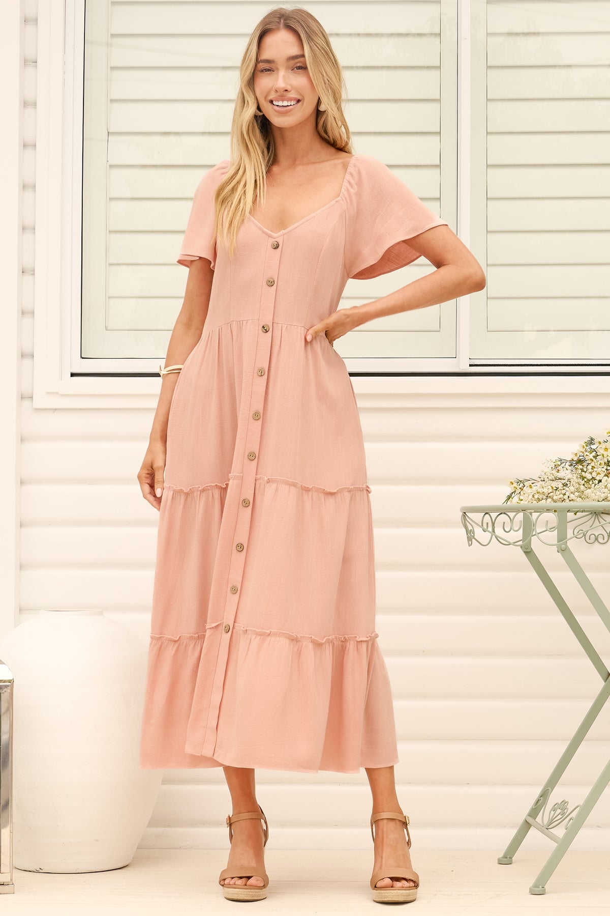 Model wearing Karina Midi Dress in Pink from Salty Crush