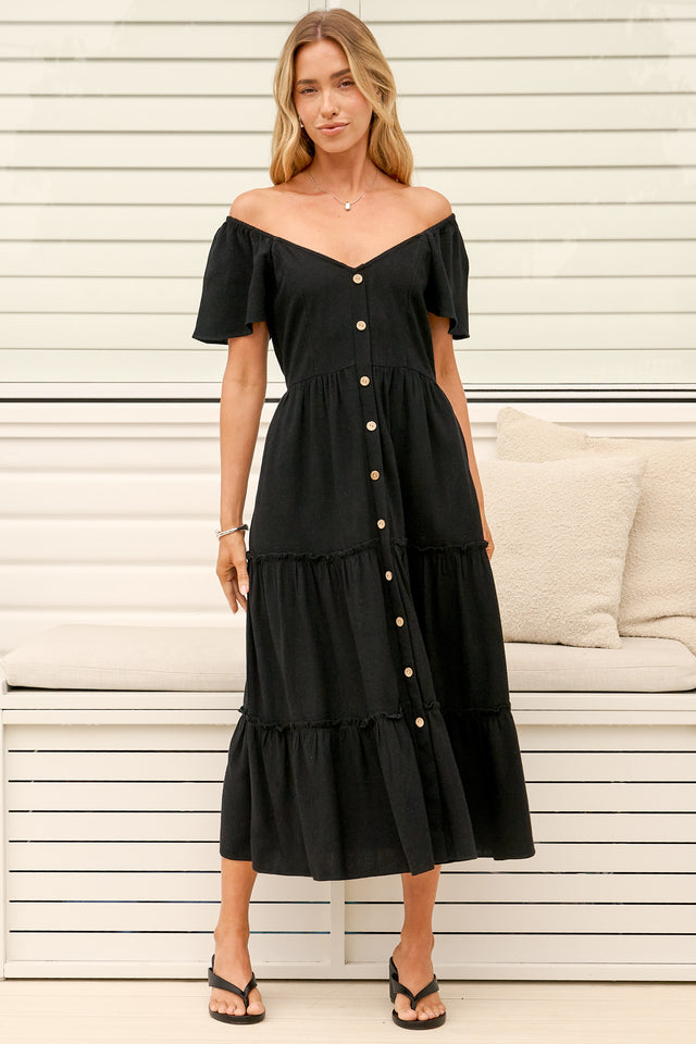 Model wearing Karina Midi Dress in Black from Salty Crush