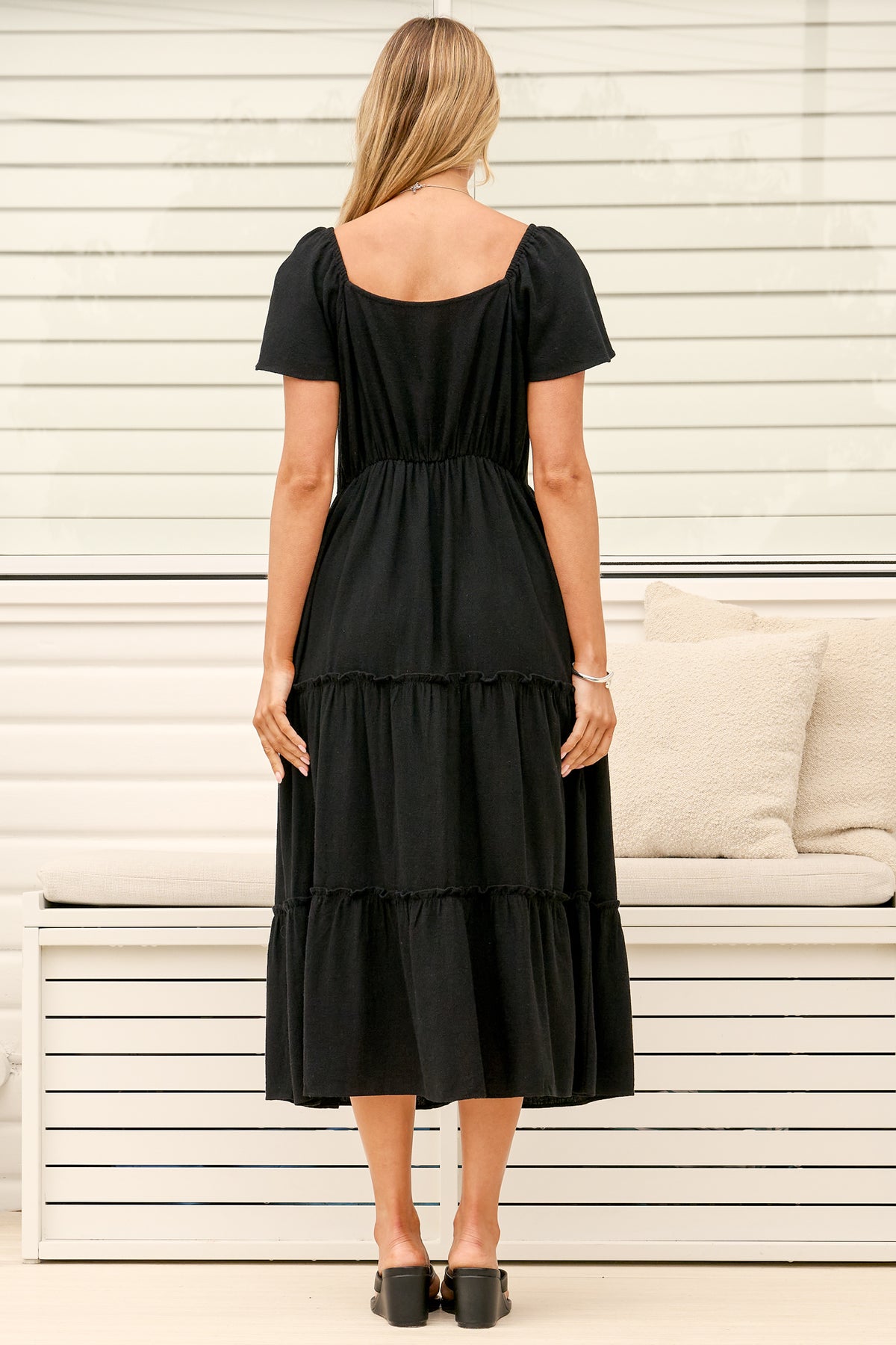 Model wearing Karina Midi Dress in Black from Salty Crush