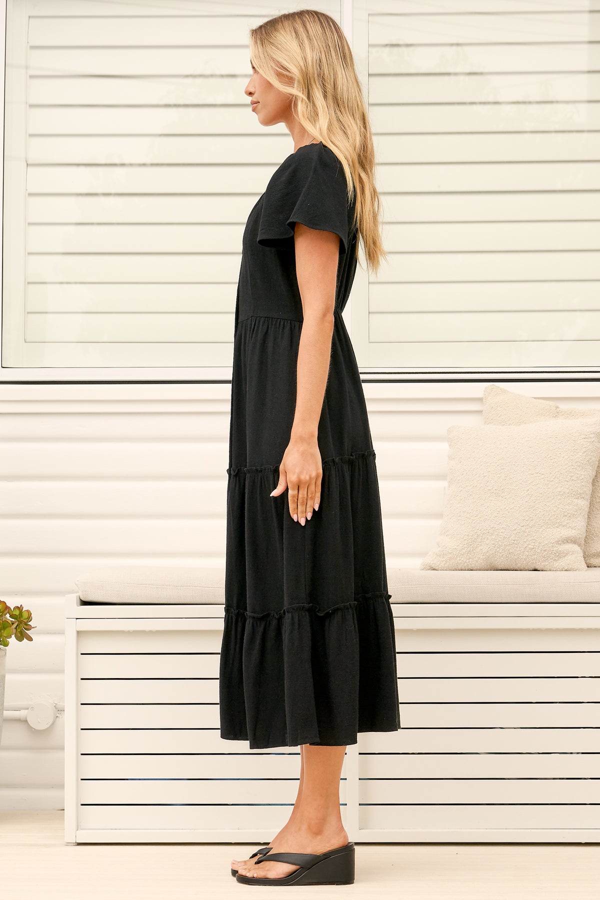Model wearing Karina Midi Dress in Black from Salty Crush