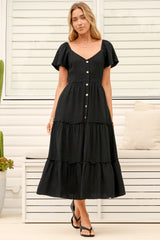 Model wearing Karina Midi Dress in Black from Salty Crush