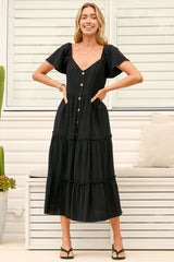Model wearing Karina Midi Dress in Black from Salty Crush