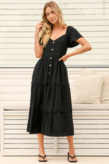 Model wearing Karina Midi Dress in Black from Salty Crush