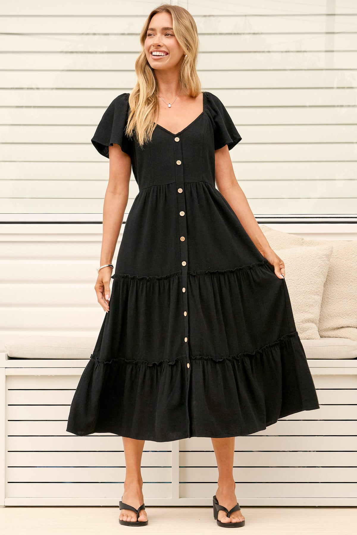 Model wearing Karina Midi Dress in Black from Salty Crush