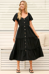 Model wearing Karina Midi Dress in Black from Salty Crush