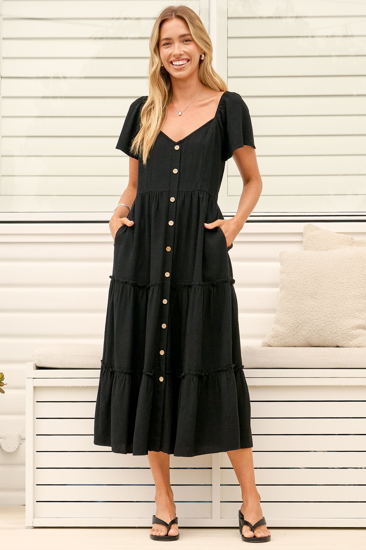 Model wearing Karina Midi Dress in Black from Salty Crush