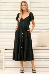 Model wearing Karina Midi Dress in Black from Salty Crush