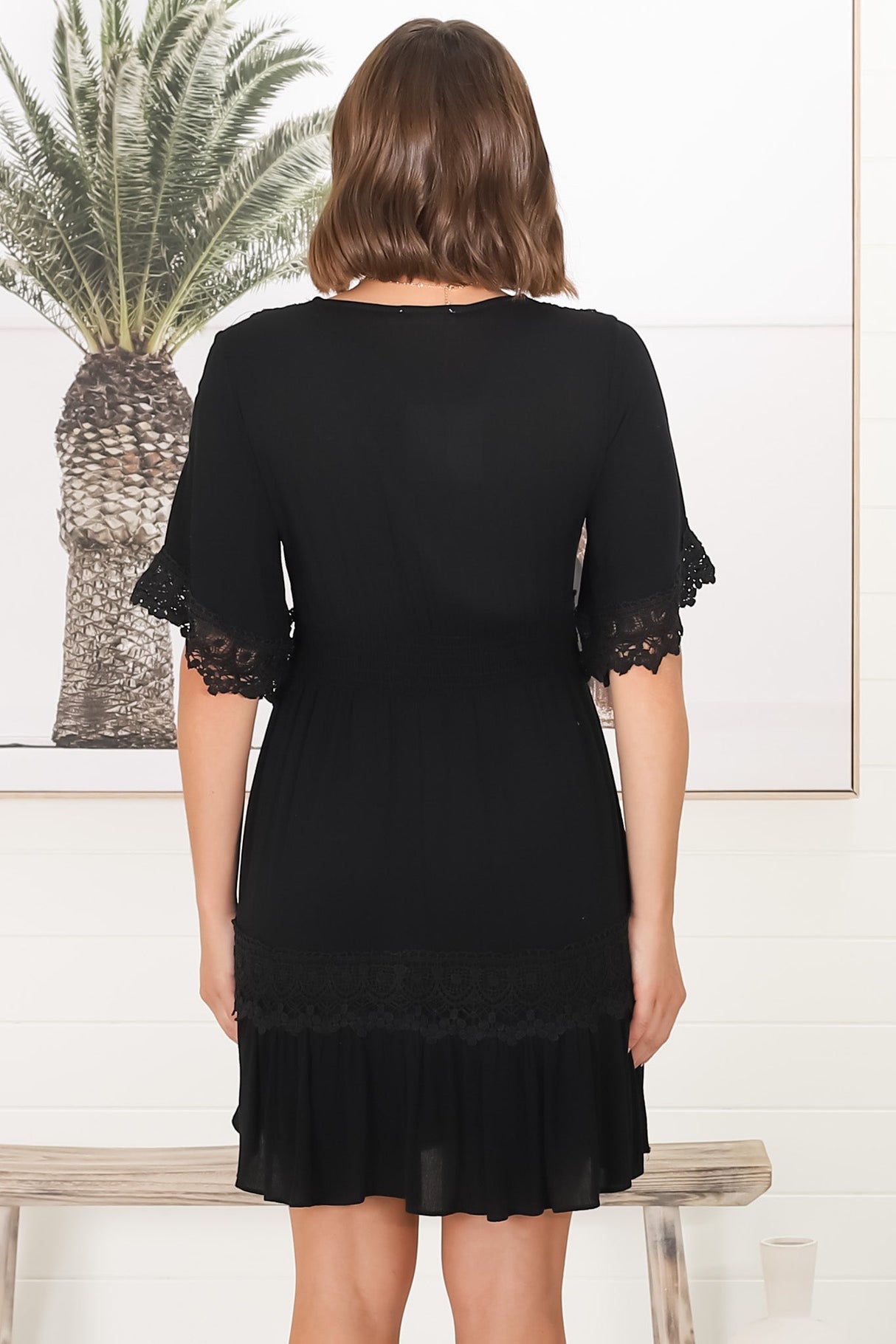 Leelie Mini Dress - Lace Embellished Tiered Dress with Bell Sleeves in Black