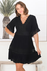 Leelie Mini Dress - Lace Embelished Tiered Dress with Bell Sleeves in Black