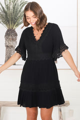 Leelie Mini Dress - Lace Embelished Tiered Dress with Bell Sleeves in Black