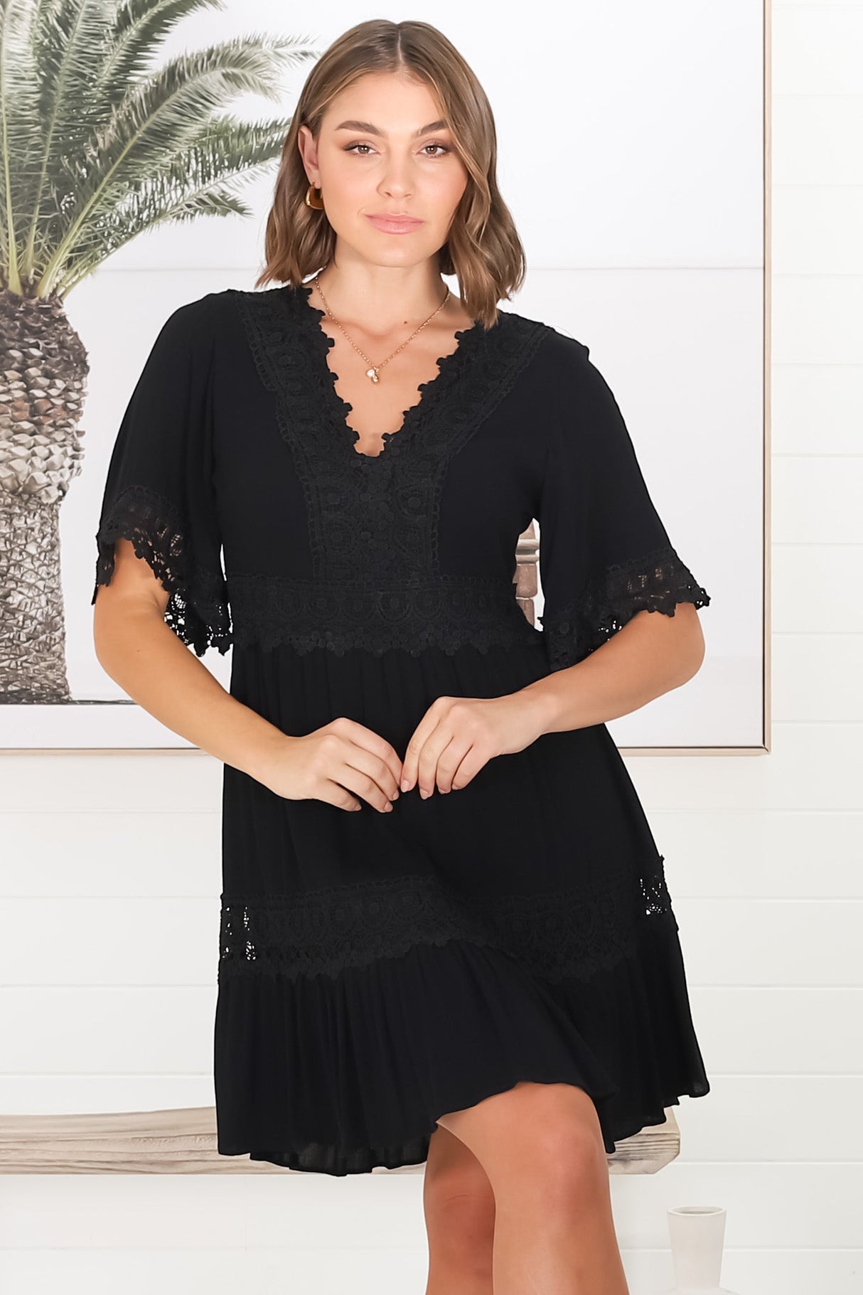 Leelie Mini Dress - Lace Embellished Tiered Dress with Bell Sleeves in Black