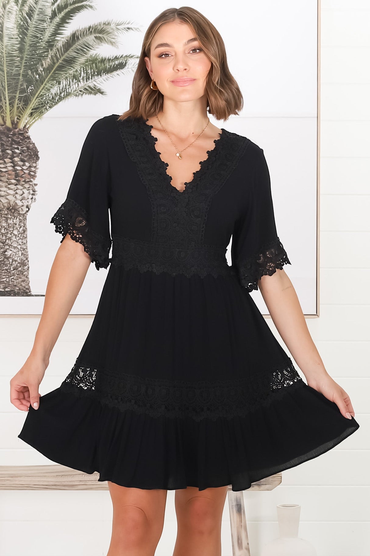 Leelie Mini Dress - Lace Embellished Tiered Dress with Bell Sleeves in Black