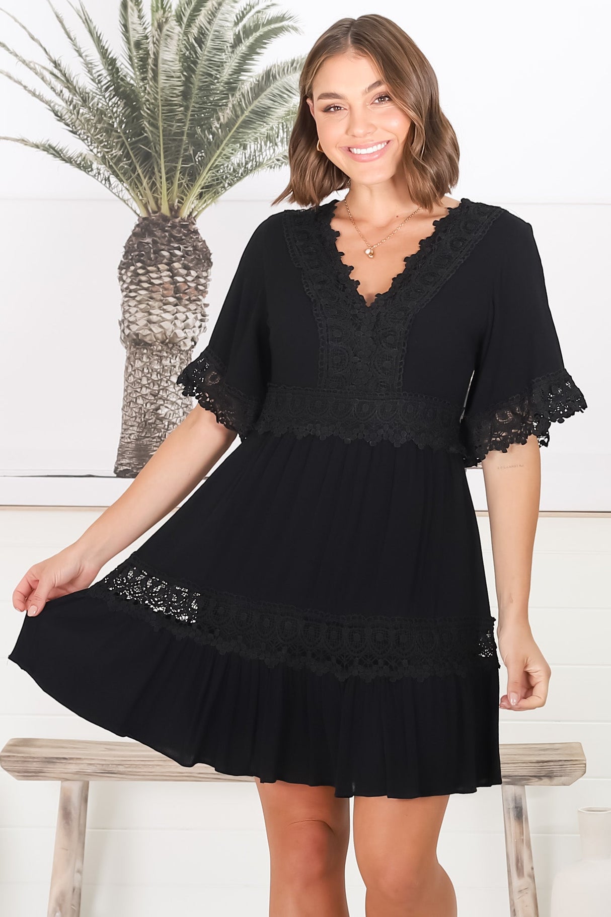 Leelie Mini Dress - Lace Embellished Tiered Dress with Bell Sleeves in Black