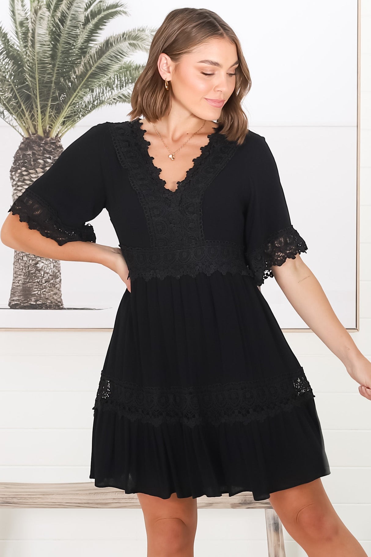 Leelie Mini Dress - Lace Embellished Tiered Dress with Bell Sleeves in Black