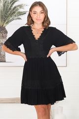 Leelie Mini Dress - Lace Embelished Tiered Dress with Bell Sleeves in Black