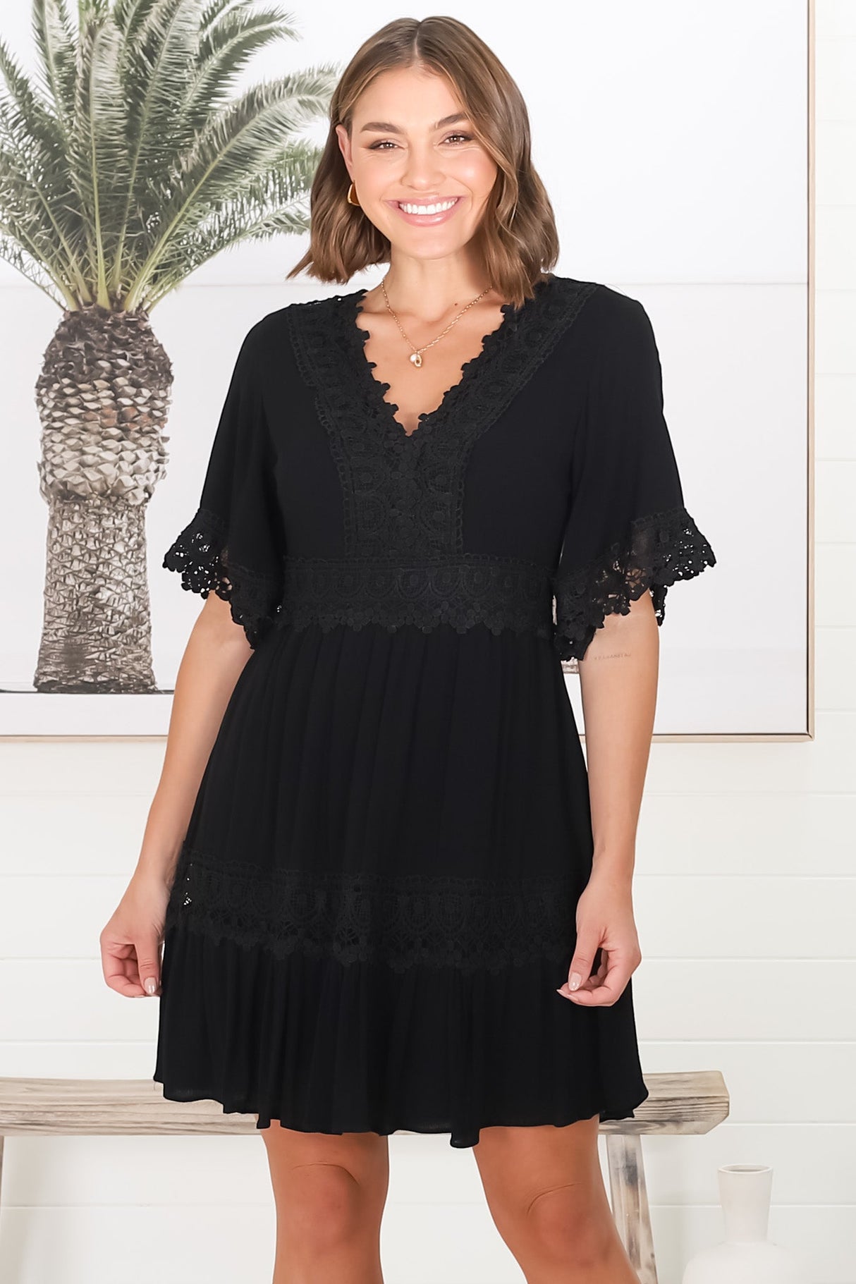 Leelie Mini Dress - Lace Embellished Tiered Dress with Bell Sleeves in Black