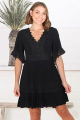 Leelie Mini Dress - Lace Embelished Tiered Dress with Bell Sleeves in Black