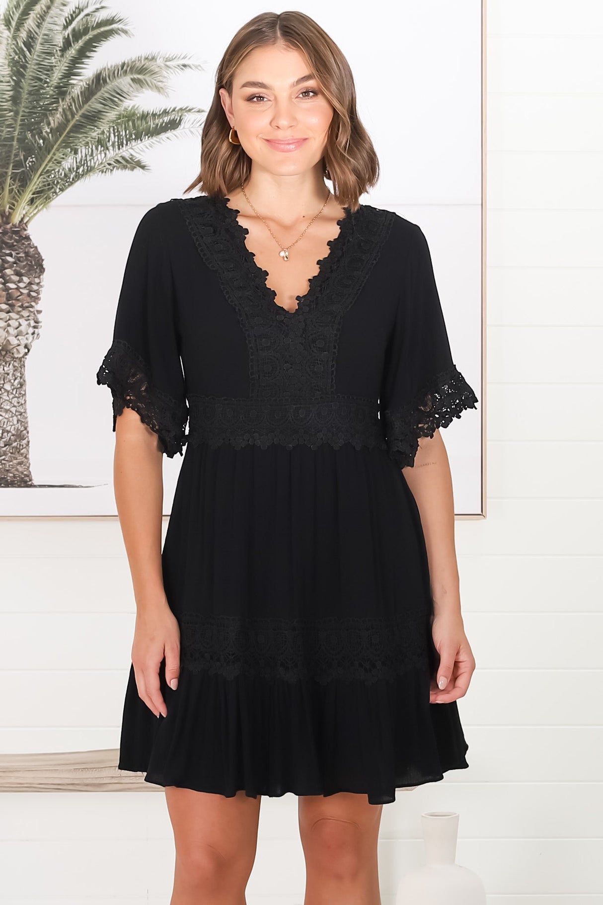 Leelie Mini Dress - Lace Embellished Tiered Dress with Bell Sleeves in Black