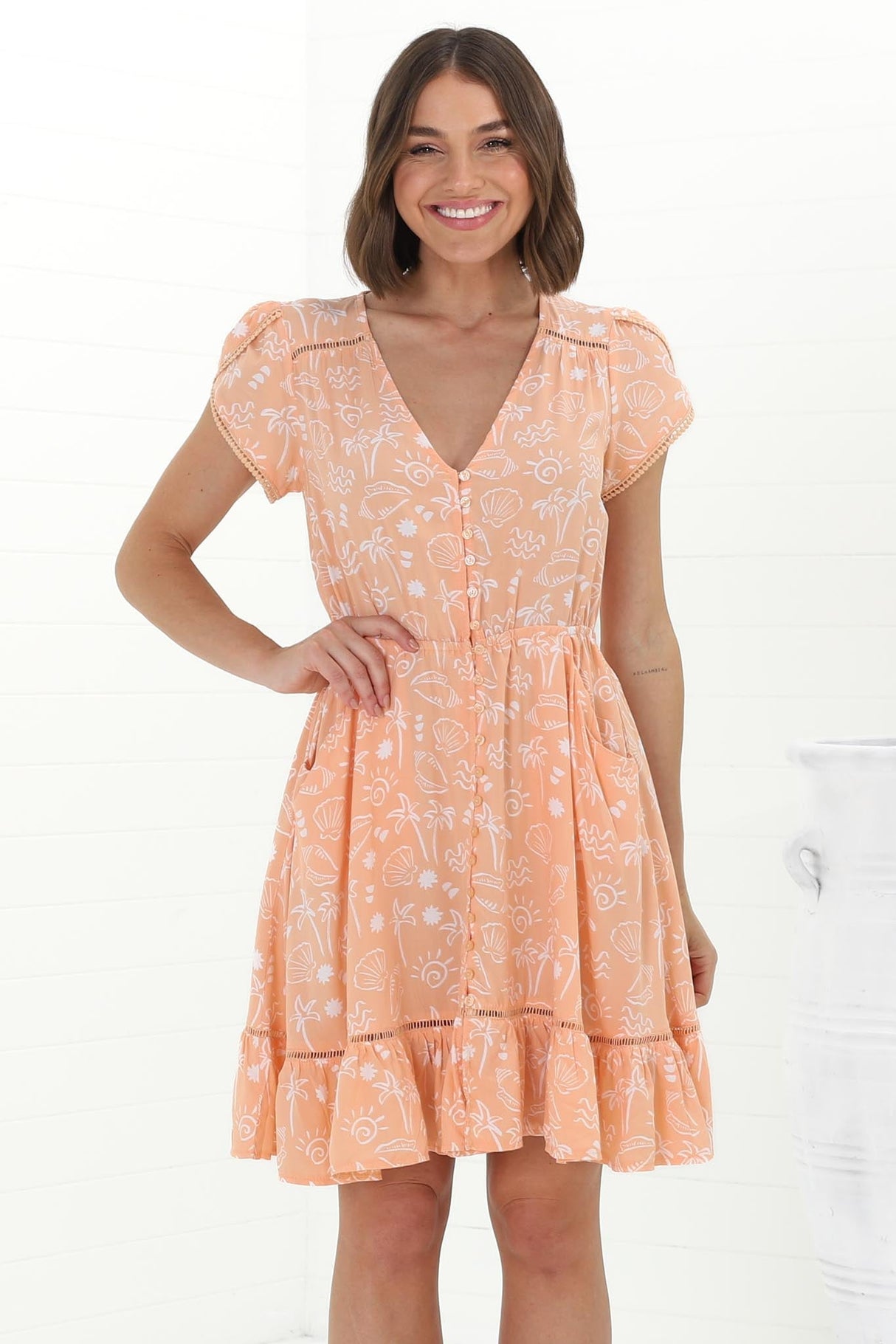 JAASE - Lizzie Mini Dress: Butterfly Cap Sleeve Button Down Dress with Pockets in Peach Island Print