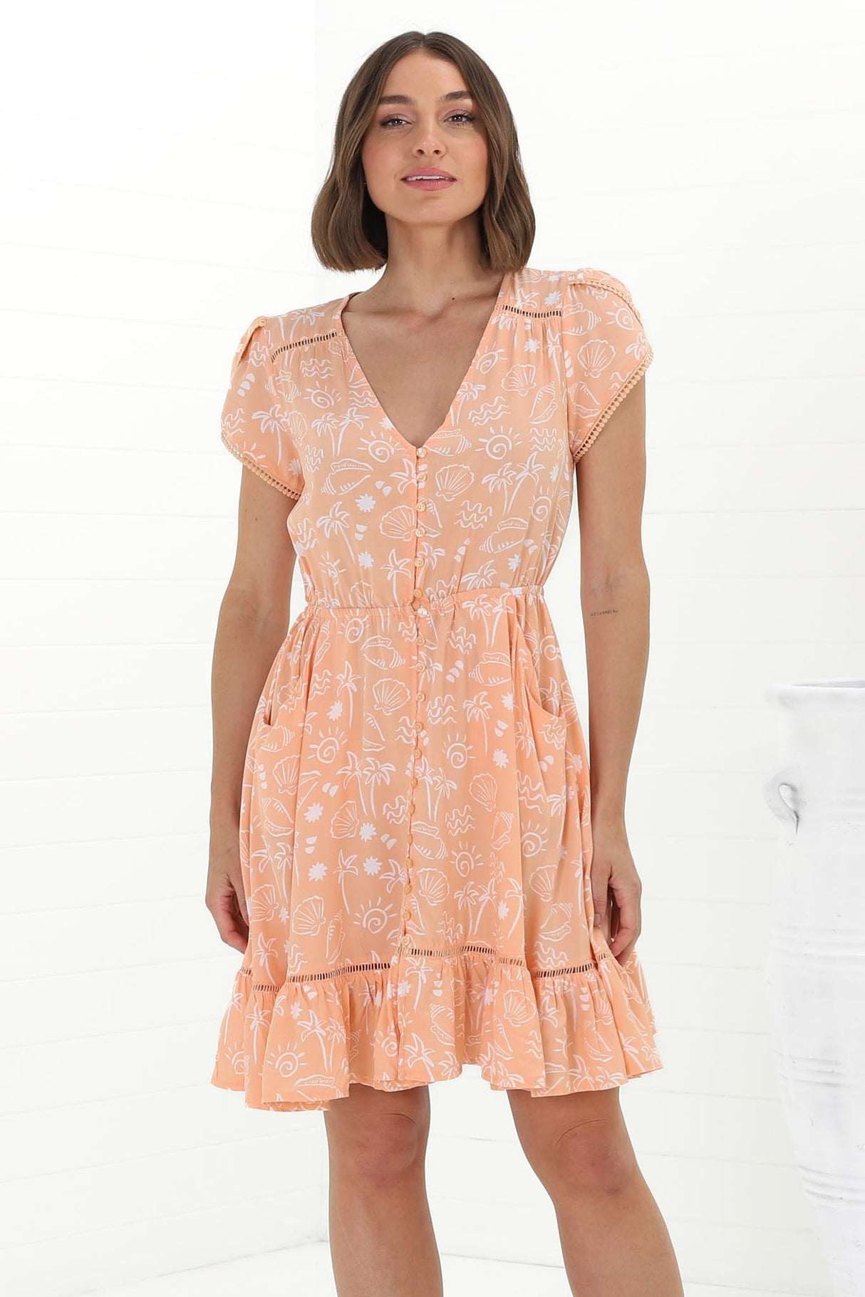 JAASE - Lizzie Mini Dress: Butterfly Cap Sleeve Button Down Dress with Pockets in Peach Island Print