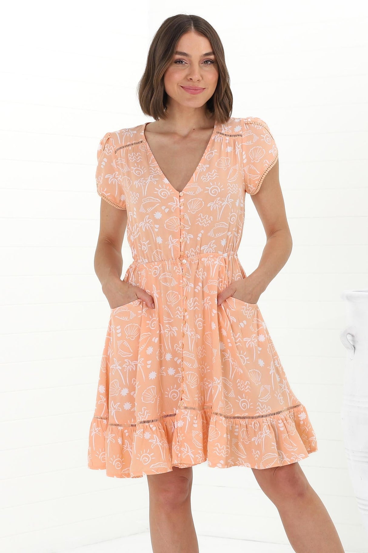 JAASE - Lizzie Mini Dress: Butterfly Cap Sleeve Button Down Dress with Pockets in Peach Island Print